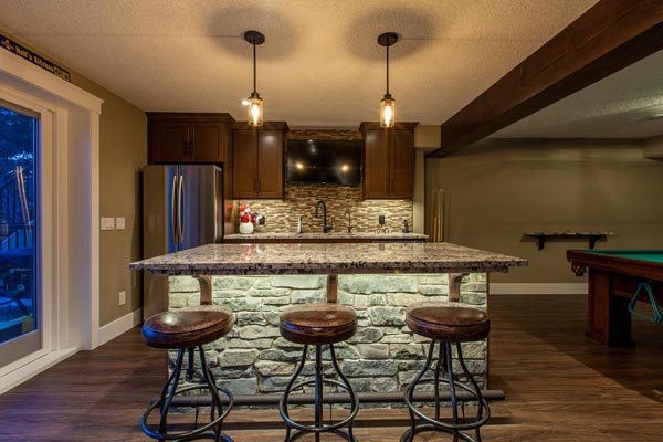 Modern Kitchen Interior in marble counter top stone decorated with 3 leather cover bar stools